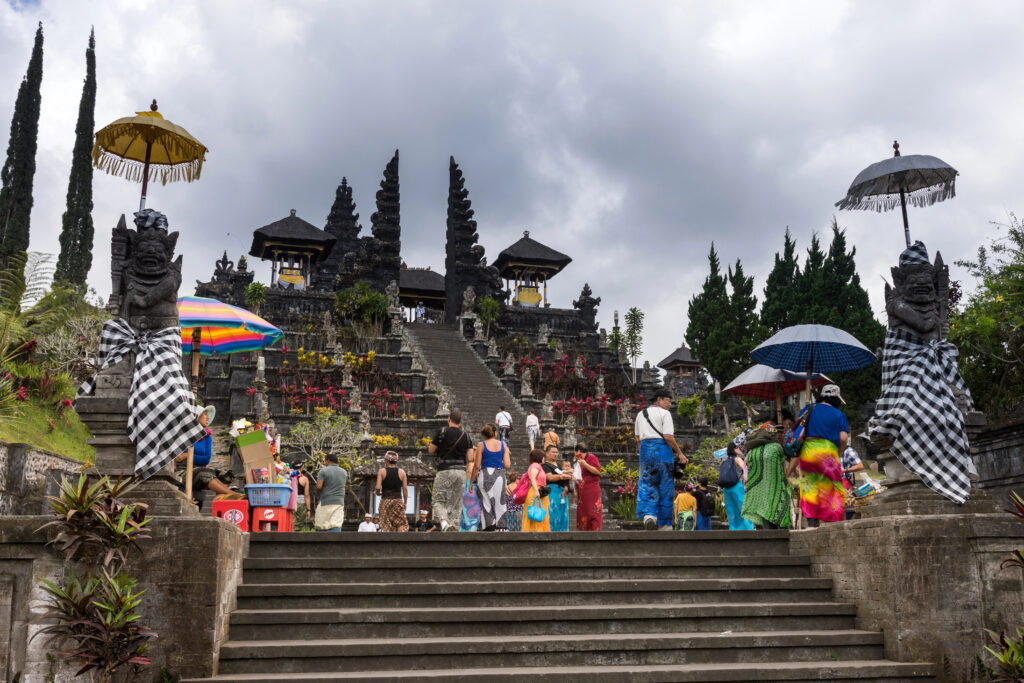Besakih Temple in Bali with visitors exploring the grounds.