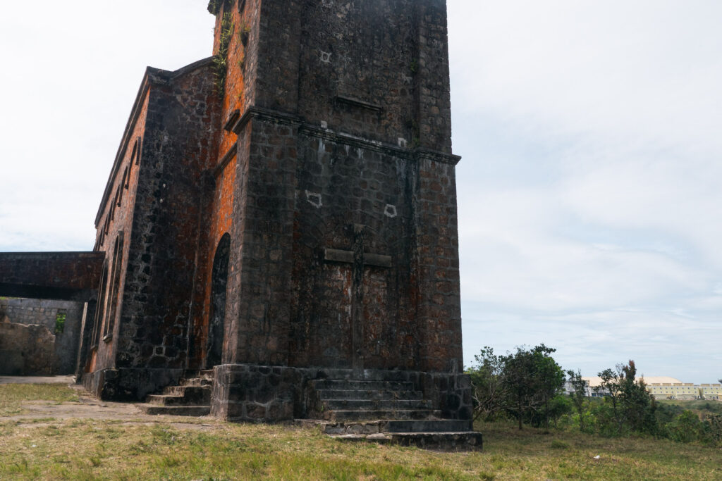 A low-angle shot of a abandoned stone building in Bokor Mountain, Cambodia