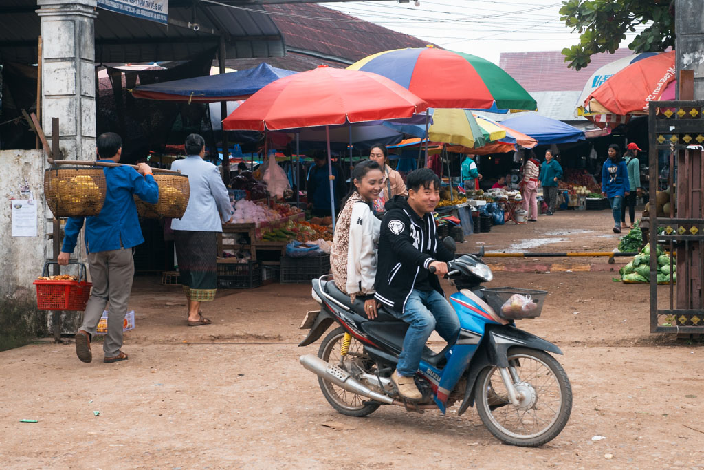 People at a day market in Laos.