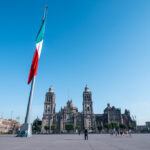 An image of Zocalo in Mexico City with the country's flag raised in the middle