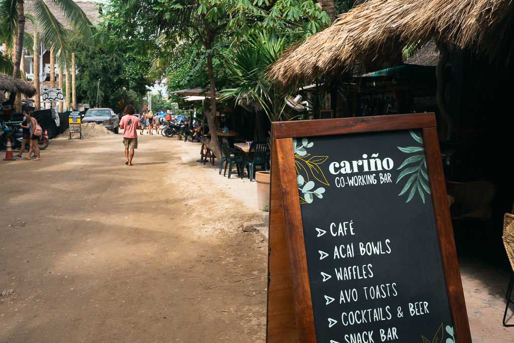 La Punta road with a signage of a co-working space menu.