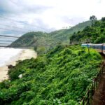 Train in Vietnam passing by the mountains and the sea.