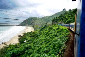 Train in Vietnam passing by the mountains and the sea.